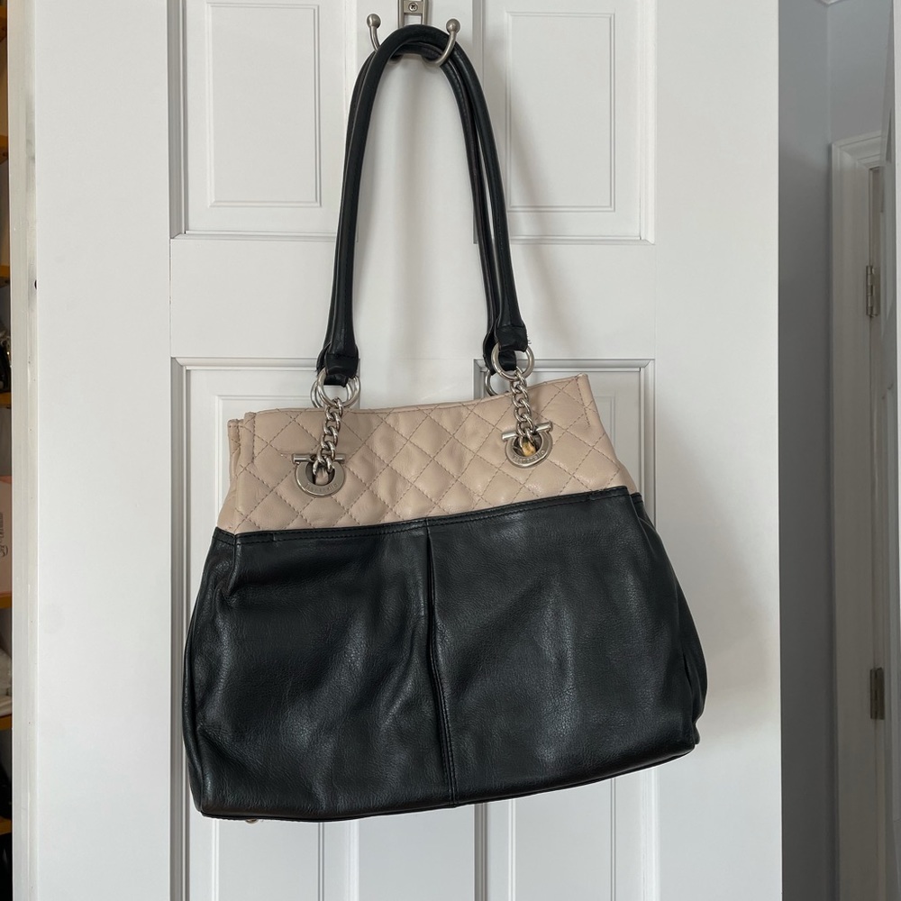 Tignanello bag. Lined with separate compartments.